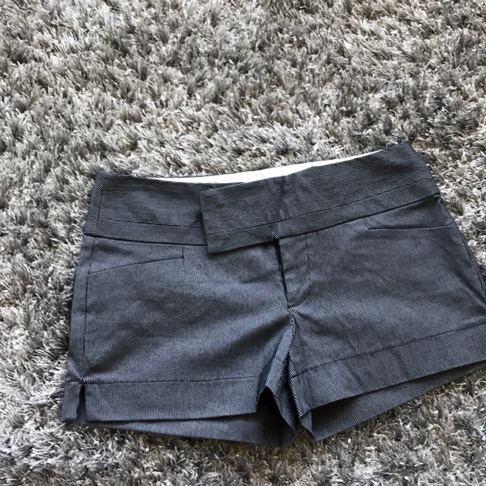 Black striped dress shorts.